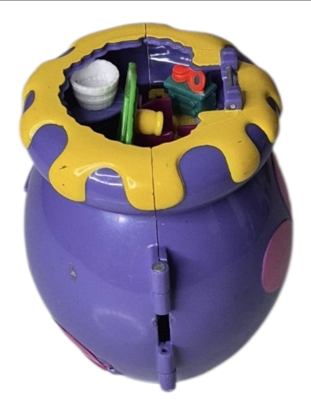 Purple & yellow plastic toy house with yellow dripping paint design